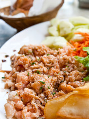 Fresh salmon salad with tomatoes.