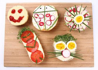 Funny sandwiches for kids on a breadboard