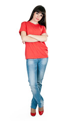 Fototapeta premium girl in red shoes and blue jeans in the studio