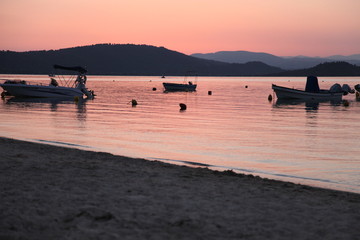 Pink sunset with boats