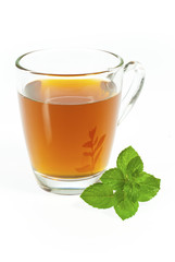 tea in glass cup with fresh mint leaves