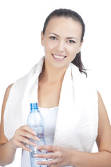 portrait of young woman standing with bottle of pure water havin