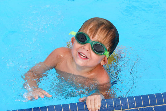 Young boy swimming in a pool