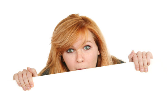 Teenage Girl Peeking Over Sign