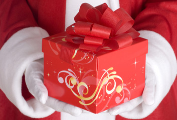 Santa Claus with a red christmas present