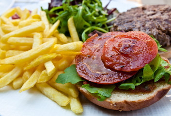 American burger with fresh salad