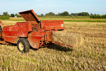 Baling hay in filed