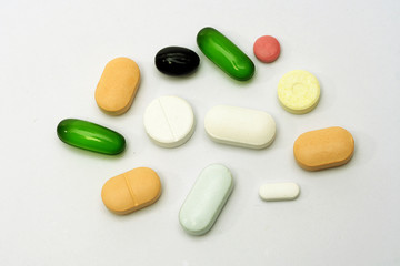 Variety of pills on white