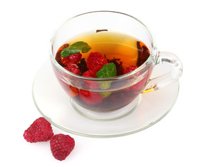 black tea, mint and raspberry in cup isolated on white