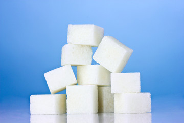 refined sugar on blue background