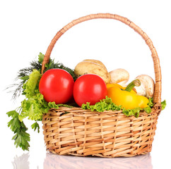 A set of vegetables in wricker basket isolated on white