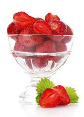 Many strawberries in glass isolated on white