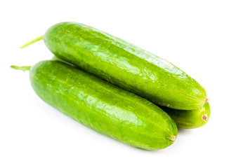Healthy food. The green cucumbers isolated on white background