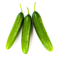 Healthy food. The green cucumbers isolated on white background