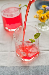 Pouring Red Colored Juice in Glass