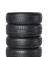 Different types of snow tires on white background