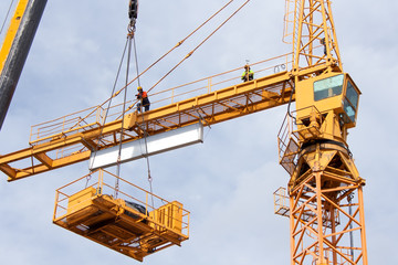 Setting up a tower crane.  The hoist winch is installed.