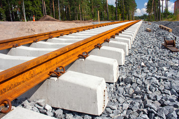 Concrete railroad ties in railway construction site - 34868655