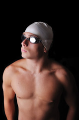 Male swimmer isolated in black