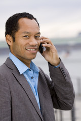 Suited male outside with mobile