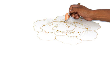 hand while drawing malaysian batik