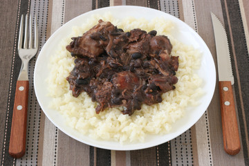 Meat with sausages and beans on rice