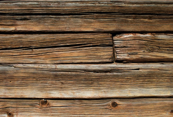 Old wooden log house wall