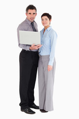 Office workers holding a laptop