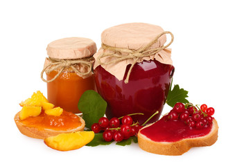 tasty currant jam and berries isolated on white