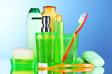bathroom accessories and soap on blue background