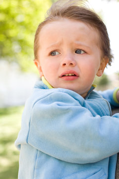 Baby girl with worried expression.