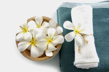 Deurstickers bowl of white frangipani with spa towel. © Mee Ting