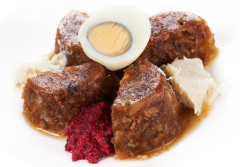 Jellied meat with boiled egg and horseradish