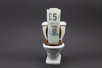 British five pound note in model toiley