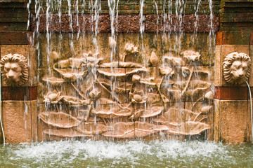 Lotus in low relief statue cut out as jig saw image and water fa