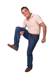 Fototapeta premium Attractive Grinning Man in Funny Pose Showing Middle Finger