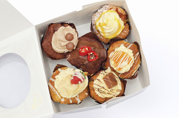 Cupcakes squashed in a box