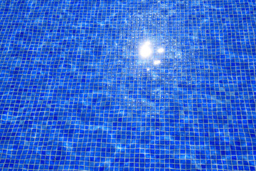 Naklejka premium blue tiles swimming pool water reflection texture