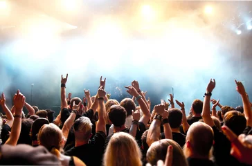 Foto op Plexiglas concert crowd in front of bright stage lights © DWP
