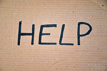 Help written on cardboard