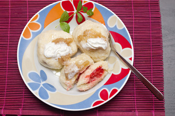 sweet dumplings filled with fruits on the plate