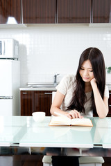 attractive asian woman in the kitchen