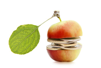 Money in the middle of an apple isolated on a white