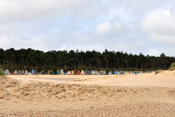 Fototapeta na wymiar Traditional Beach Huts along the beach
