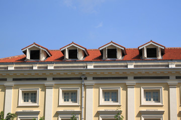 Gable on the roof townhouse in city.