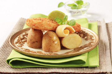 Fototapeta na wymiar Fried fish and potatoes