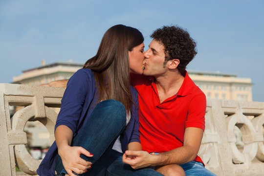 Happy Young Couple Kissing