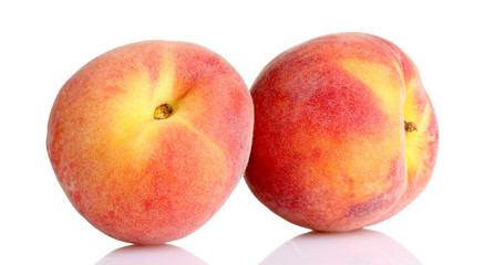 Fresh peaches isolated on white