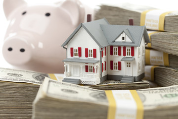 Small House and Piggy Bank with Stacks Money