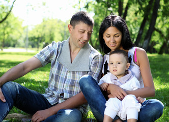 Naklejka na ściany i meble Family together in the summer park